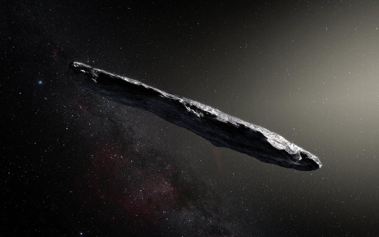 Artist impression of Oumuamua interstellar asteroid showing elongated dark red object